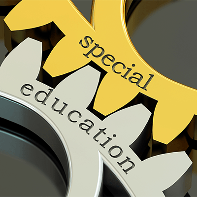 Image of two gears fitting together to say Special Education. One gold gear on the top right says "special," and one silver on the bottom left says "education.”